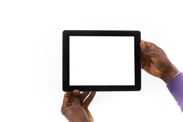 African man holding a tablet computer in his hand — ストック写真