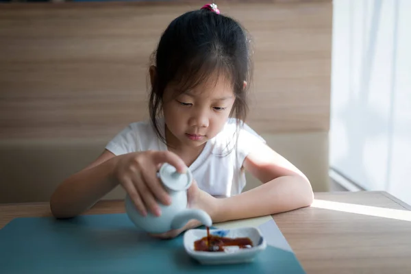 Asian Child, Girl, Pouring Soy Sauce — Stock Photo, Image