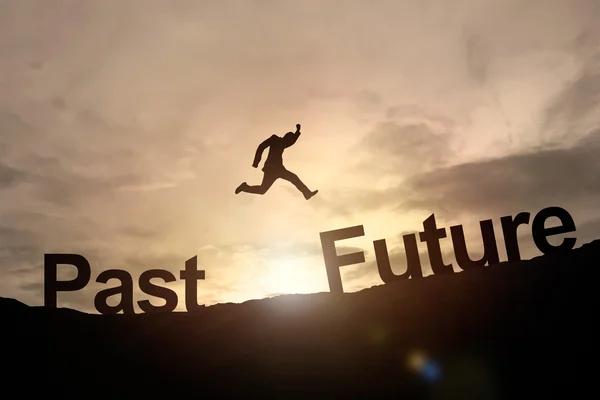 Silhouette of businessman glowing jump past to future. success concept — Stock Photo, Image