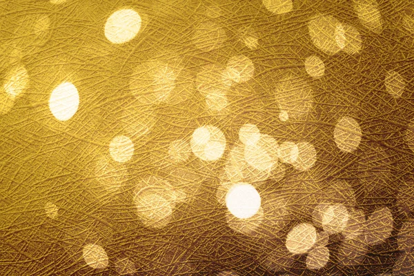 Abstract circle gold bokeh on background texture.