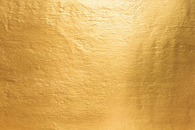 Beton duvara altın arka plan dokusu.