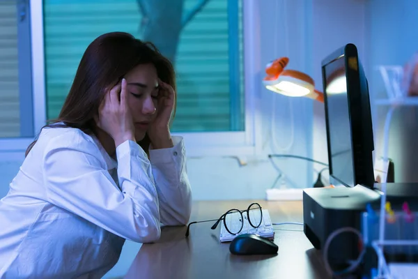 Portrait of young stressed woman sitting at home office desk. To — Stock Photo, Image
