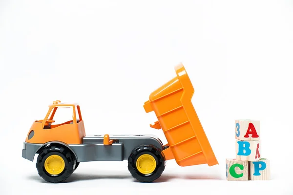 Plastic orange toy truck on white background — Stock Photo, Image