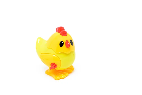 Дитяча іграшка пластикова курка на білому тлі — стокове фото