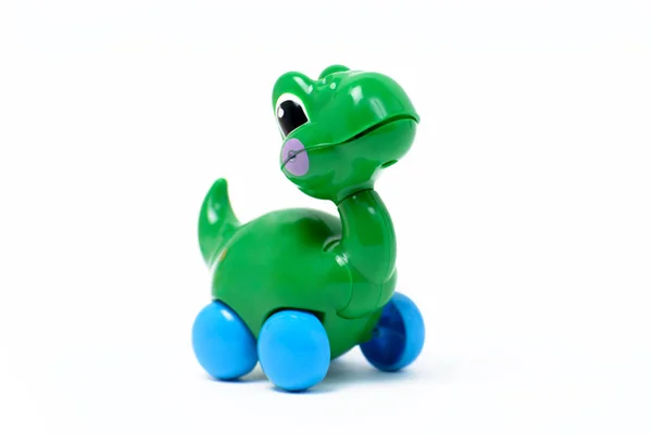 Годинники пластикова іграшка зелений динозавр / дракон — стокове фото