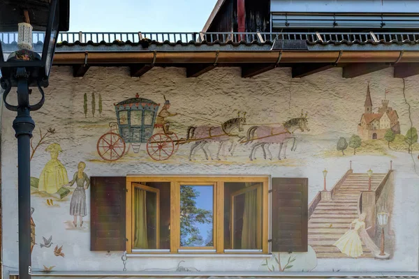 Fragment of building facade with Lueftlmalerei mural paintings ( — Stock Photo, Image