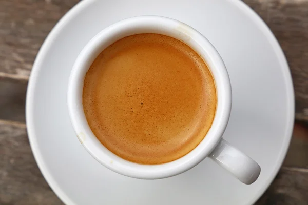 Espresso coffee in white cup close up top view Royalty Free Stock Images