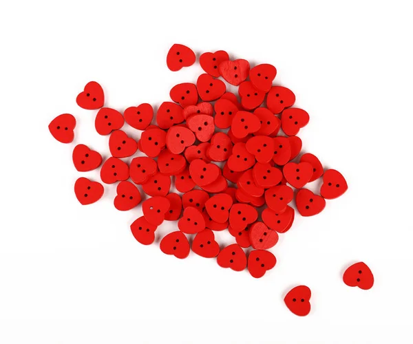 Röda hjärtformade sy knappar isolerad på vit — Stockfoto