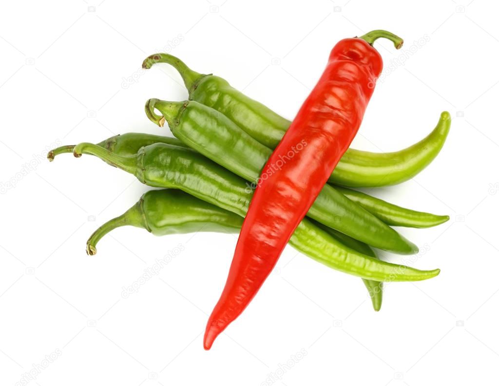 Green and red hot chili peppers close up on white