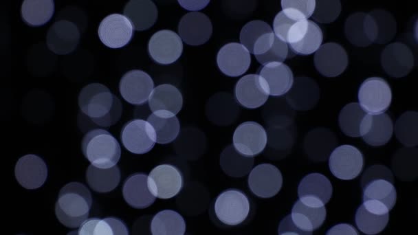 Witte feestelijke lichten op donkere achtergrond bokeh — Stockvideo