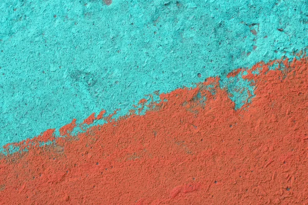 Blue and orange painted concrete wall texture