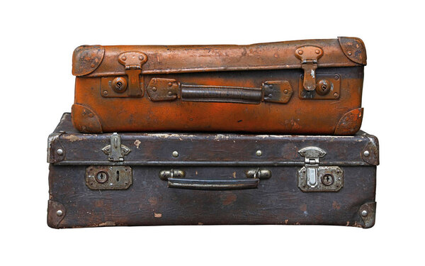 Old vintage travel suitcases isolated on white