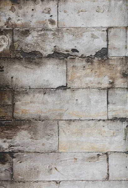 Wall of gray travertine adarce stone bricks — Stock Photo, Image