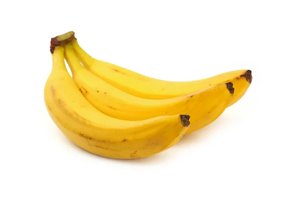 Kilka żółtych bananów na białym tle — Zdjęcie stockowe