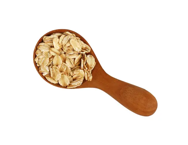 Porridge oat grits in wooden scoop on white — Stock Photo, Image