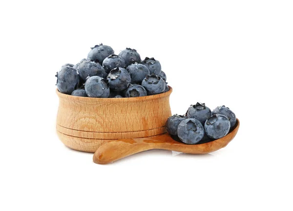 Blueberry in wooden spoon and bowl white isolated — Stock Photo, Image