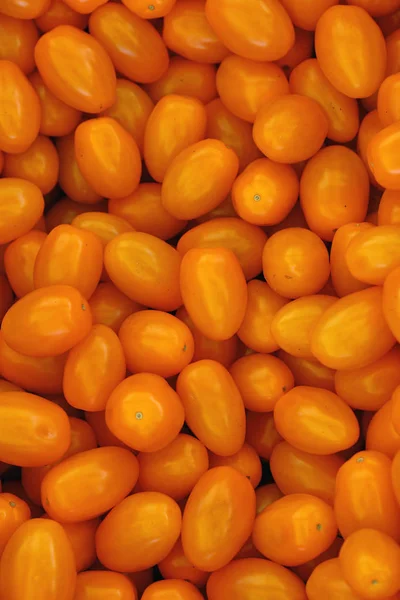 Close up fresh yellow cherry tomatoes in retail — Stock Photo, Image