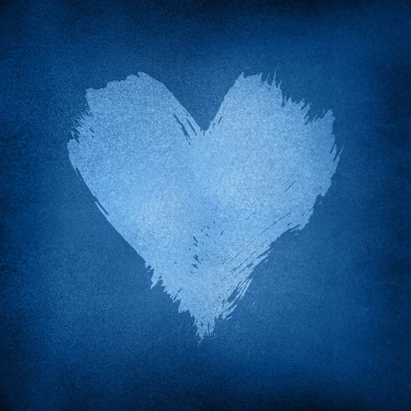 White watercolor painted heart shape over dark blue — 스톡 사진
