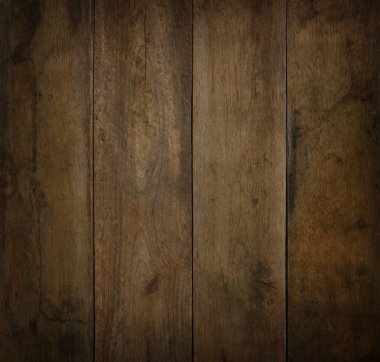 Eski, eski, kahverengi ahşap ahşap kaplama. Arka planda çizikler ve ahşap taneciklerin üzerinde siyah lekeler var.