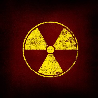 Sarı radyoaktif tehlike uyarısı işareti kopyalama alanı ile grunge kahverengi ve siyah arkaplan üzerine boyanmış
