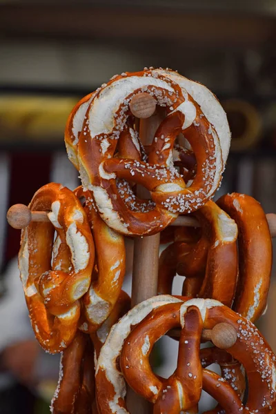 Close Several Fresh Traditional German Pretzel Bread Knots Hanging Retail — Stock Photo, Image