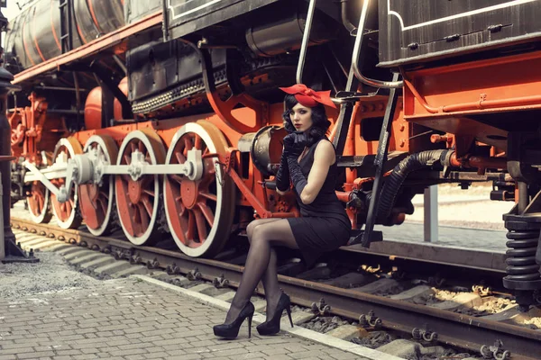 Young girl at the retro train station