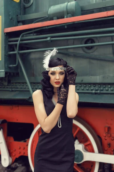 Young girl at the retro train station