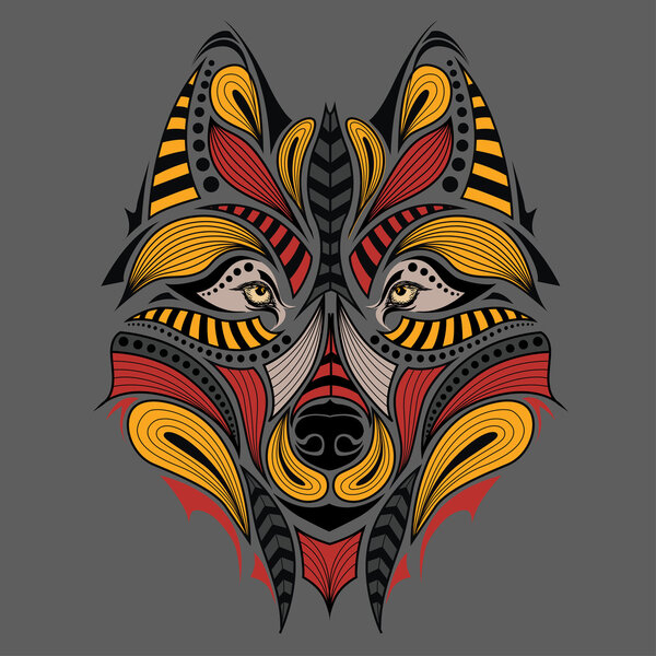 Patterned colored head of the wolf. African / indian / totem / tattoo design. It may be used for design of a t-shirt, bag, postcard and poster.