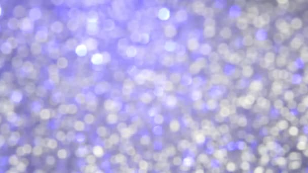 Moving pastel blue glitter lights on white bokeh background, defocused light random reflections — 비디오