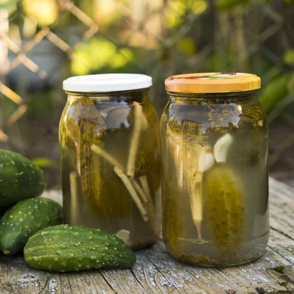 Preserving pickled cucumbers. Pickles jars.