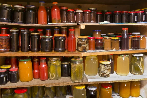 Preserving pickled cucumbers and mushrooms. Pickles jars. — Stock Photo, Image