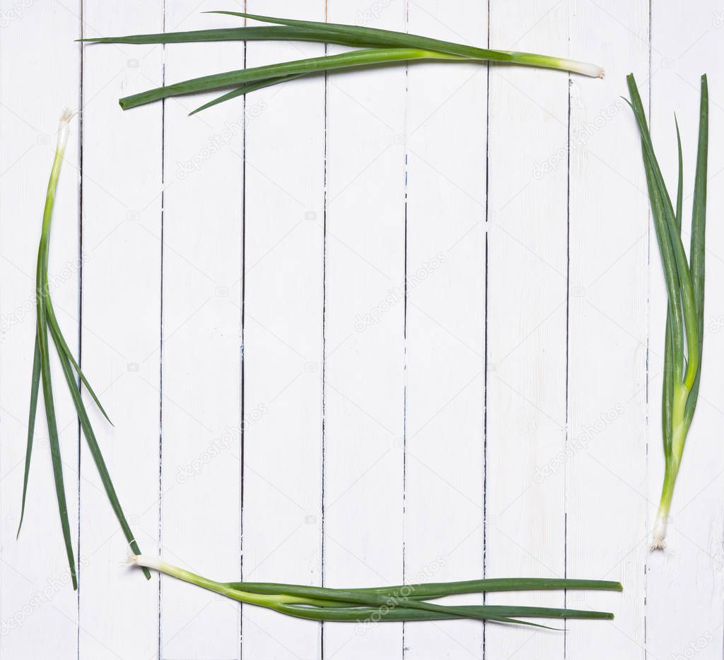 Fresh chives on rustic wooden background.