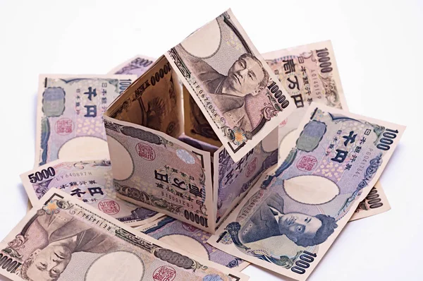 Коттедж из японских иен банкнот, жилищный кредит . Стоковая Картинка