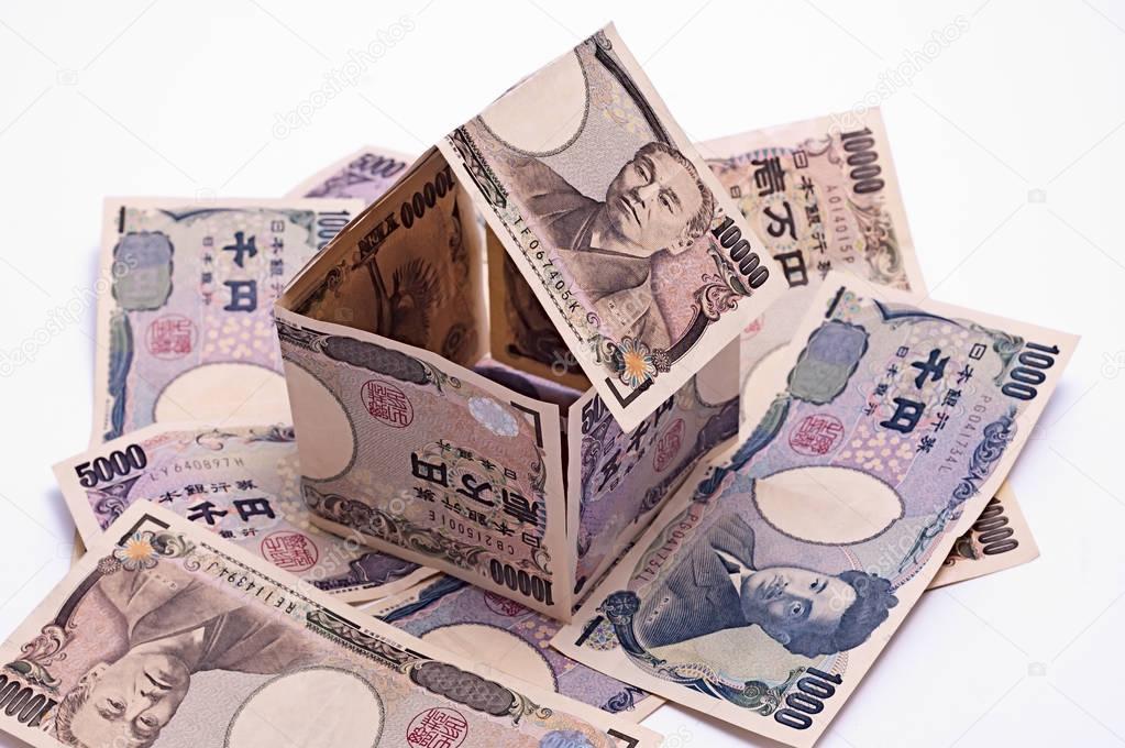 Cottage made of yapanese yen banknotes, housing loan.
