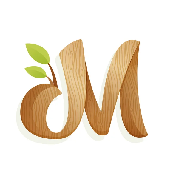 M dopis logo s texturu dřeva a zelené listy. — Stockový vektor