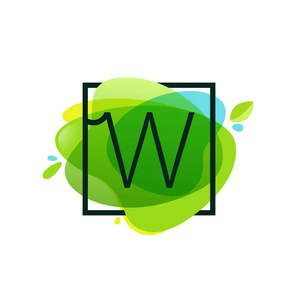 W letter logo in square frame at green watercolor splash backgro — Stock Vector