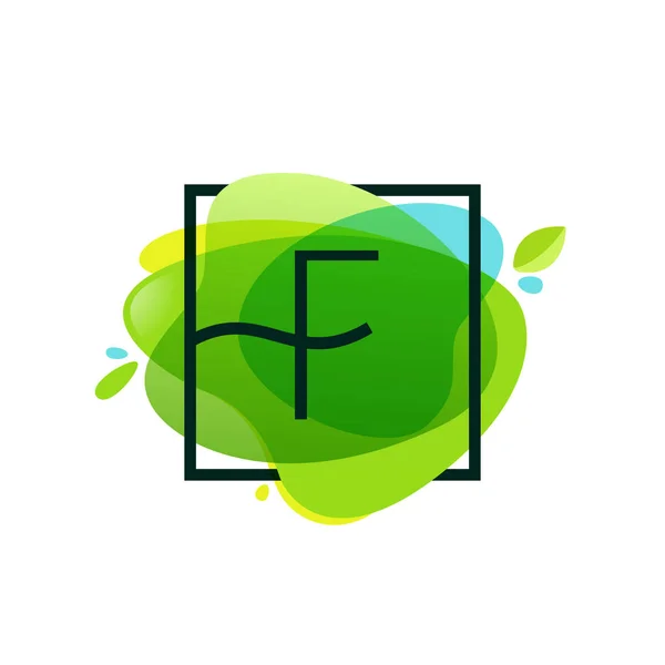 F letter logo in square frame at green watercolor splash backgro — Stock Vector