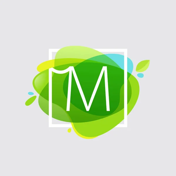 M letter logo in square frame at green watercolor splash backgro — Stock Vector