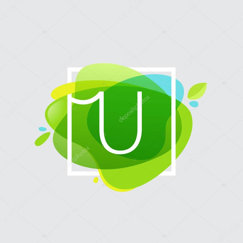 U letter logo in square frame at green watercolor splash backgro