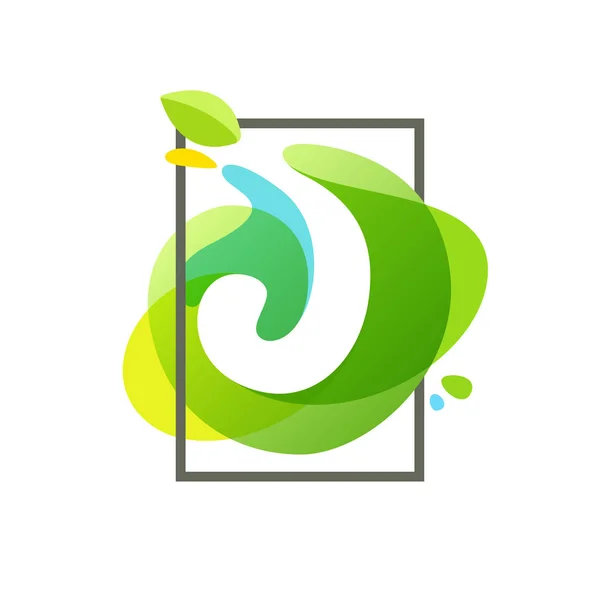 J brev logotyp i fyrkantig ram på gröna akvarell splash backgro — Stock vektor