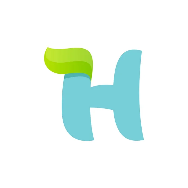 H dopis logo s zelený list. — Stockový vektor