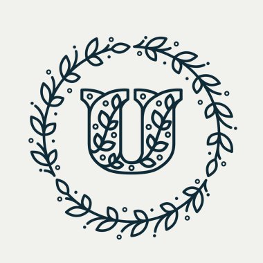 Çember defne çelenginde çiçek deseninden oluşan U harfi logosu.