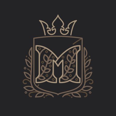 M harfi logosu çiçek desenli harflerden oluşur.