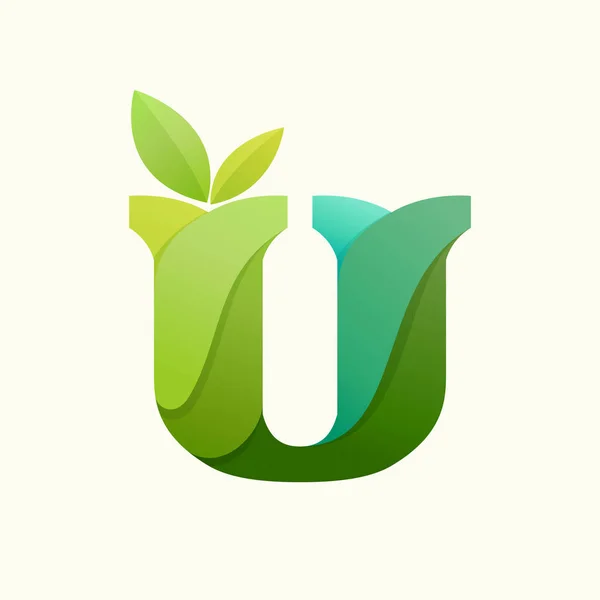 Wirująca litera U logo z zielonymi liśćmi. — Wektor stockowy