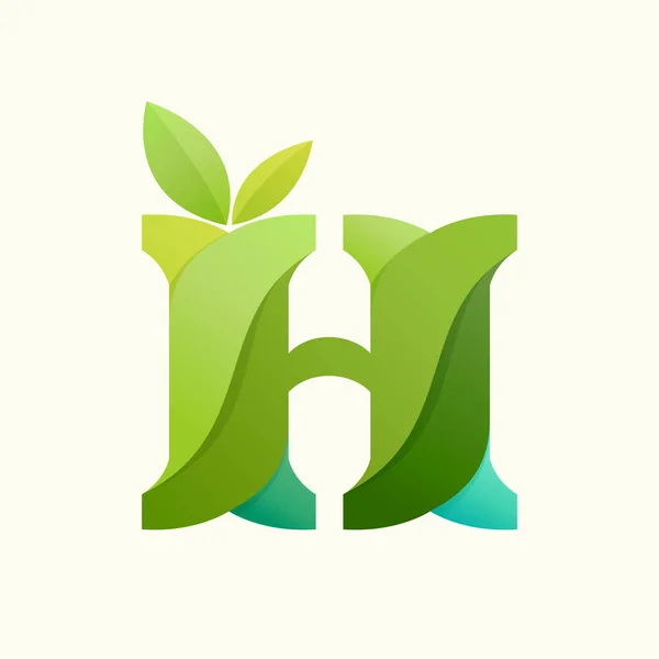 Swirling letter H logo with green leaves. — Stock Vector