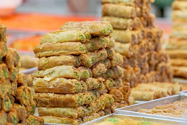 Honey Baklava made in the form of a pyramid, the sweet showcase in the store — Stock Photo, Image