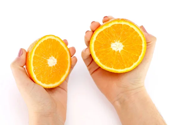 Orange in a cut in his hands — Stock Photo, Image