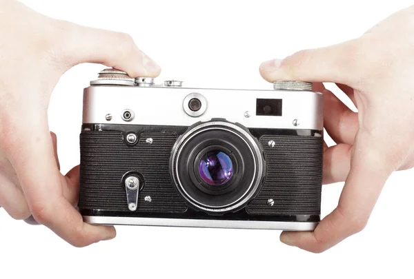 Vintage camera in de hand geïsoleerde, close-up — Stockfoto