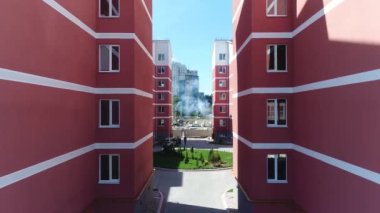 Construction site with a bird's eye in a megacity. New house in a new residential complex. Flying over the construction site. aerial panoramic top view from hight copter drone flying sky footage