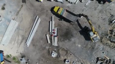 Construction site with a bird's eye in a megacity. New house in a new residential complex. Flying over the construction site. aerial panoramic top view from hight copter drone flying sky footage